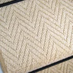 Close-up of Baileys Herringbone Stair Runner carpet texture.