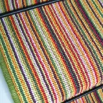 Close-up of Summer Garden striped stair runner texture.