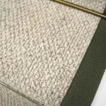 Close-up of a Inishowen Hessian Wool Stair Runner with a green border.
