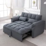 Dark gray, plush, tufted sofa bed with thick cushions