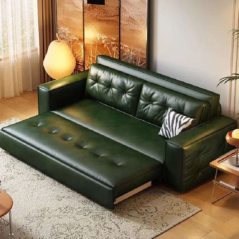 Dark green faux-leather sofa bed with tufted cushions