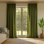 Dark green pencil pleat linen curtains framing a large window