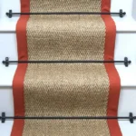 herringbone pewter sisal stair runner on a staircase with a black border