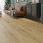 LVT flooring in a living space with a brown leather sofa