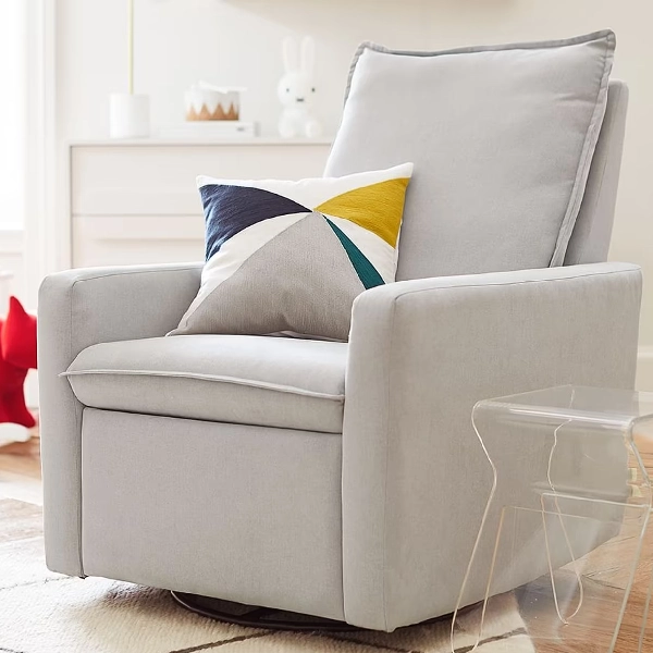 Light gray velvet single sofa with a geometric color block throw pillow