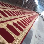 Red and gold patterned mosque carpet