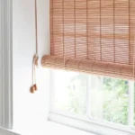 Rolled-up natural bamboo blind