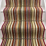 Strata wool striped stair runner with multicolored stripes and brass stair rods. (1)