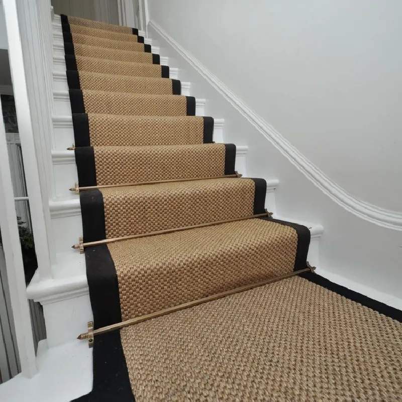 Tan sisal stair runner with black edges
