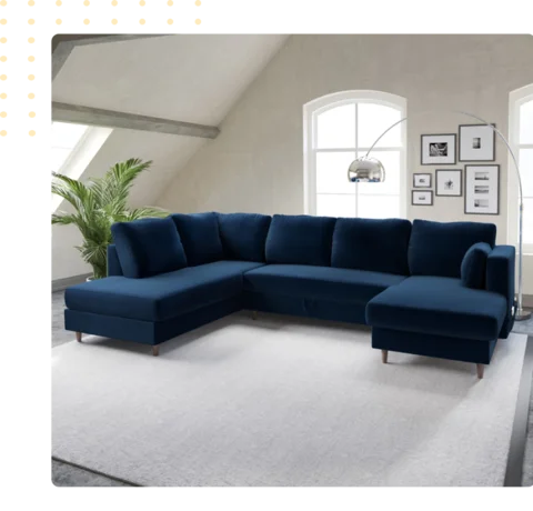 U shaped sectional sofa upholstered in deep navy blue velvet