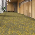Wall-to-wall carpet with a bold yellow-green abstract pattern