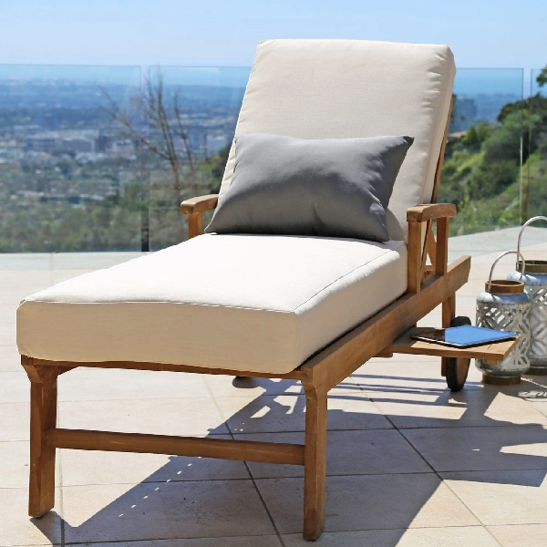 Wooden chaise lounge chair with cream-colored cushion