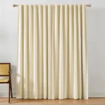 beige blackout curtain with vertical folds