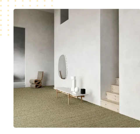 beige textured carpet in a minimalist room with white walls