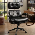 black leather ergonomic office chair with a separate headrest and black rolling base