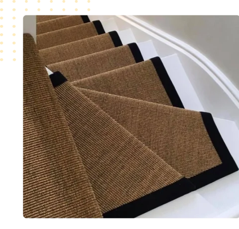 brown textured stair runner featuring a black border