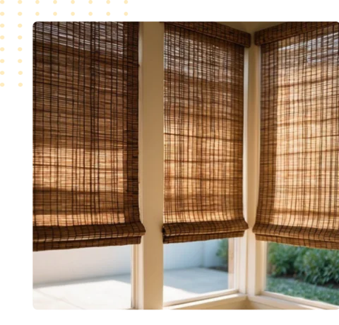 dark brown, woven bamboo blinds in the corner window