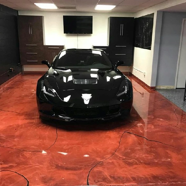 high-gloss metallic red and orange marbled epoxy floor in a modern garage