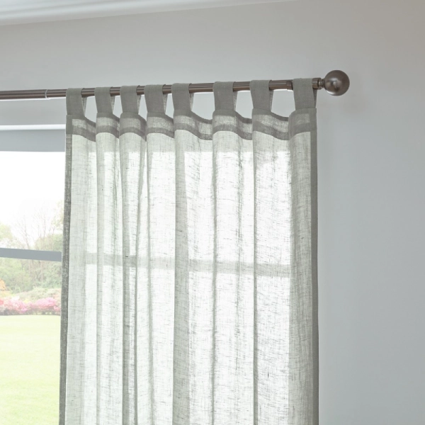 light gray sheer linen curtain with a tab top header