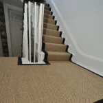 natural fiber stair runner with a dark black border