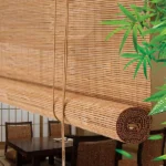 rolled-up natural tone bamboo blind