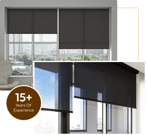 two windows with large dark gray roller blinds