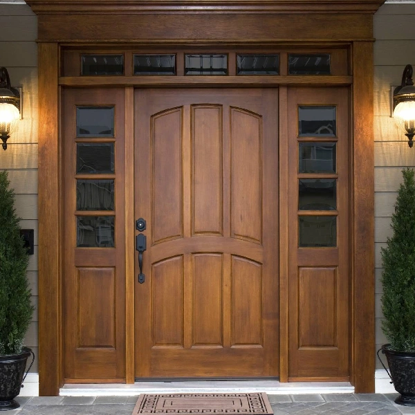 wood entry door with vertical panels, framed by sidelights