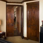 wood interior doors with vertical planking and arch tops