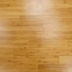 Bamboo flooring with a natural light wood finish.