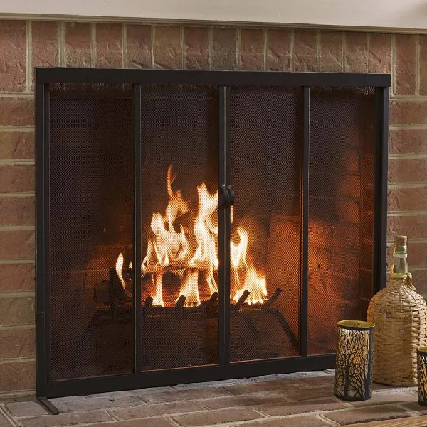 Black metal fireplace screen with two hinged mesh doors