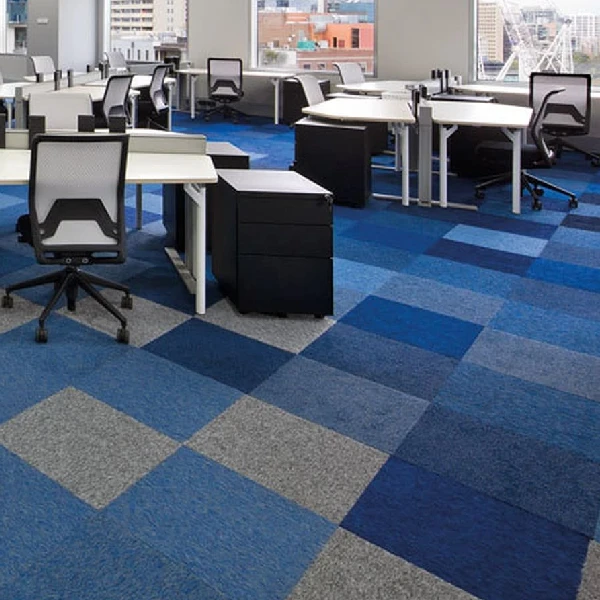 Blue and gray modular carpet tiles in geometric pattern