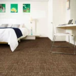 Brown textured wall-to-wall carpet with a subtle cross-hatched pattern