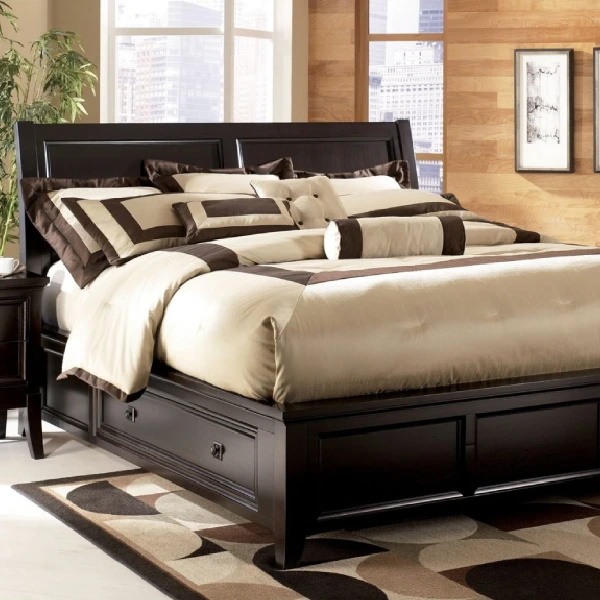 Dark brown kingsize bed with a large headboard