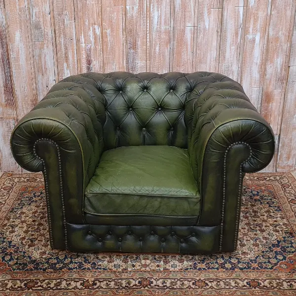 Deep green distressed leather Chesterfield armchair
