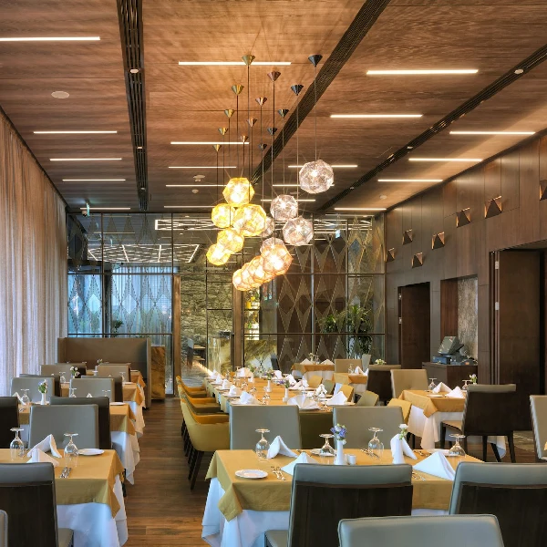 Elegant restaurant with long rows of tables,
