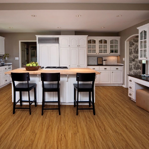Golden oak wood-look vinyl flooring in white kitchen