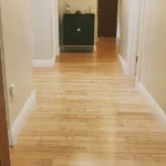 Hallway with natural light-colored bamboo flooring