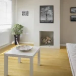 Living room floor made of light-colored horizontal bamboo planks
