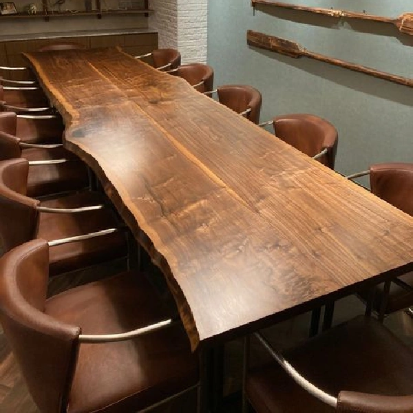Long, live-edge natural wood communal table