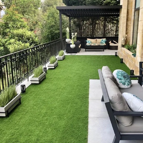 Lush artificial turf covering a modern balcony