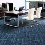 Navy blue textured office carpet tiles in modern office