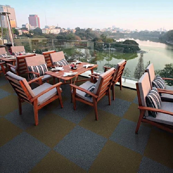 Outdoor dining area on a rooftop patio with square