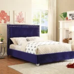 Queen-size platform bed upholstered in deep purple velvet with a diamond-tufted headboard