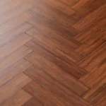 dark reddish-brown bamboo flooring in a herringbone pattern