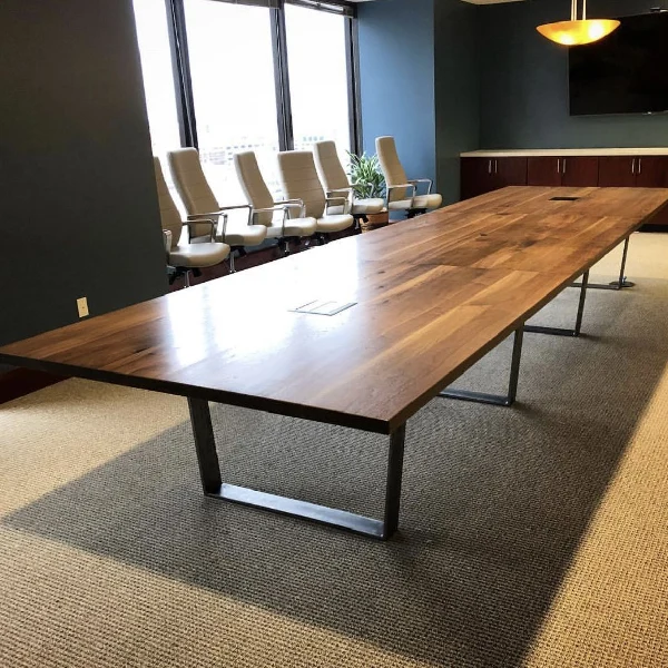 dark wood conference table with black metal U-shaped legs