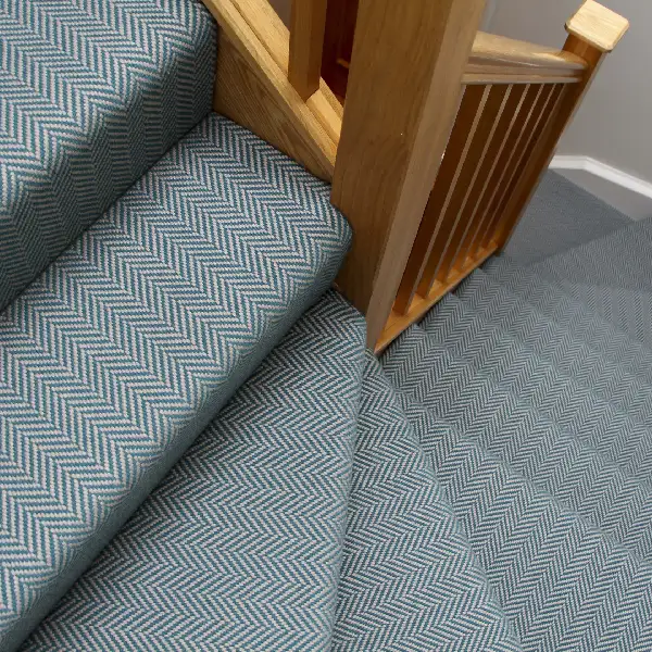 teal and white chevron-patterned carpet runner