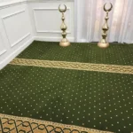 green mosque carpet with a gold and brown patterned horizontal prayer
