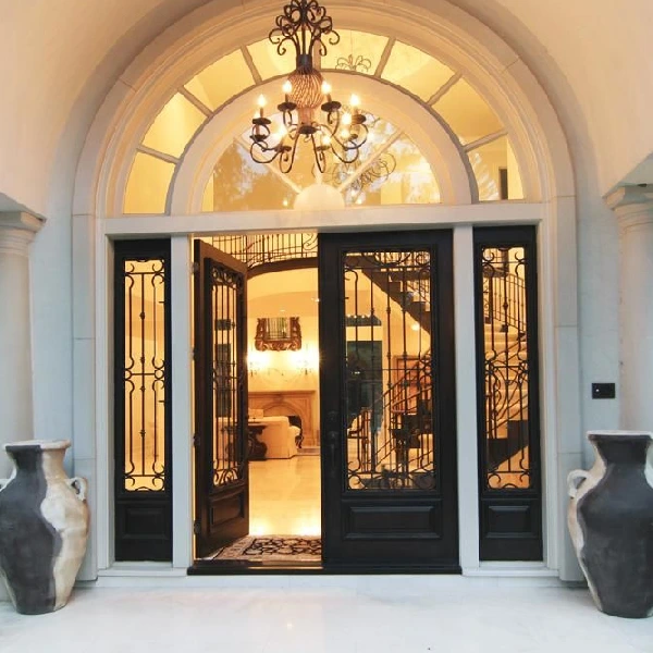 luxurious villa entryway with a black iron and glass door