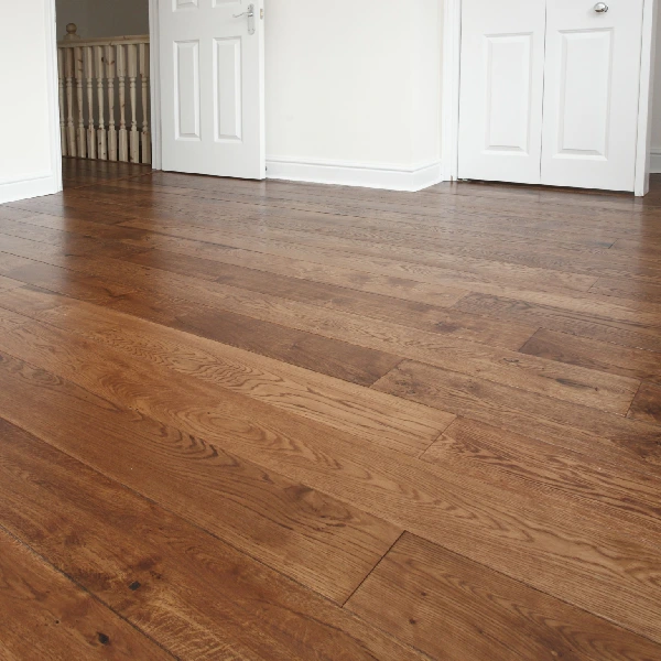 medium-brown engineered hardwood flooring with natural wood grain