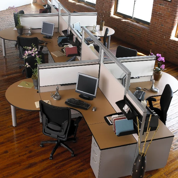 modern open office floor plan with curved cubicle workstations separated by white